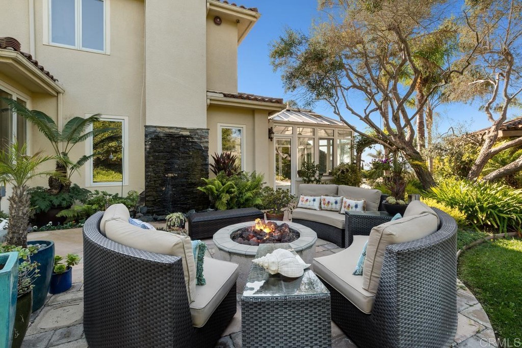 1620 Bella Vista Drive Encinitas, CA 92024 - Photo 32 of 35 a view of a patio with couches table and chairs and potted plants