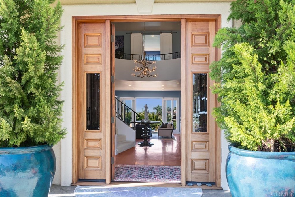 1620 Bella Vista Drive Encinitas, CA 92024 - Photo 5 of 35 a view of a lobby with a potted plant and a window