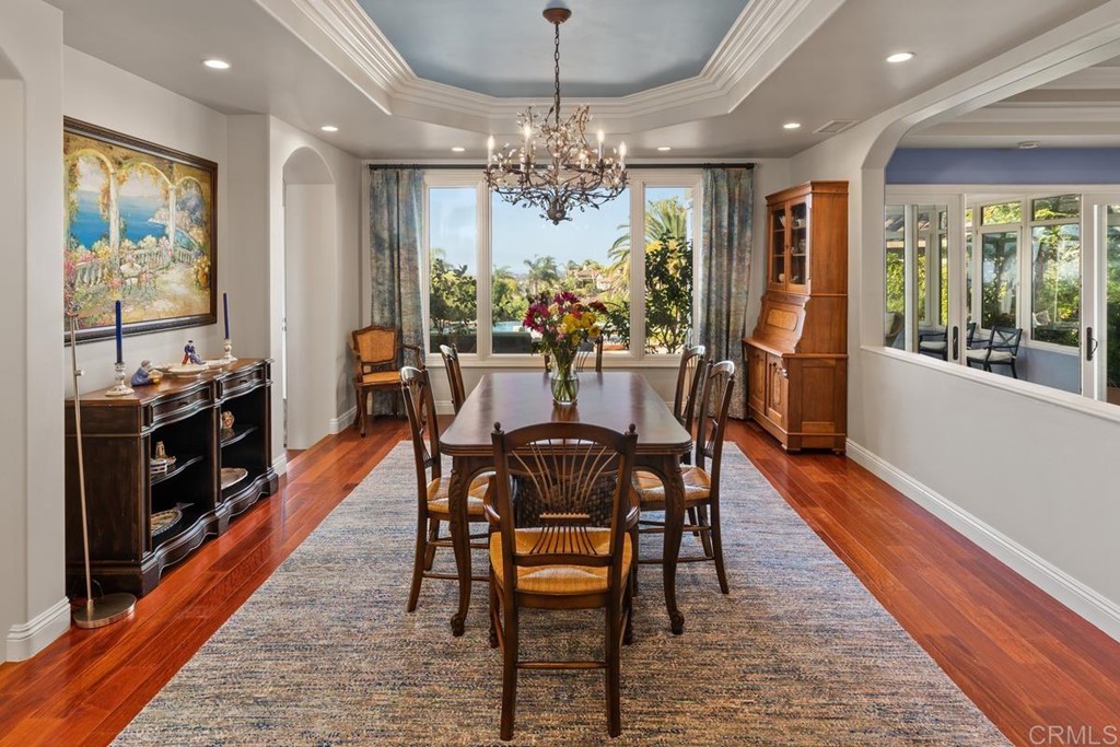 1620 Bella Vista Drive Encinitas, CA 92024 - Photo 9 of 35 a view of a dining room with furniture window and wooden floor