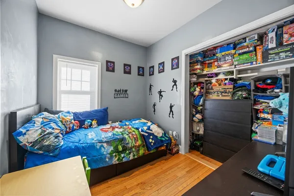 a bedroom with a bed and closet