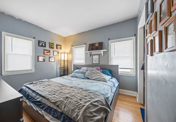 a bedroom with a bed and a dresser
