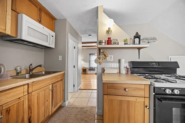 a kitchen with a stove and cabinets