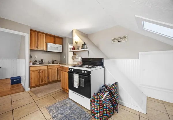 a kitchen with stainless steel appliances granite countertop a sink and cabinets