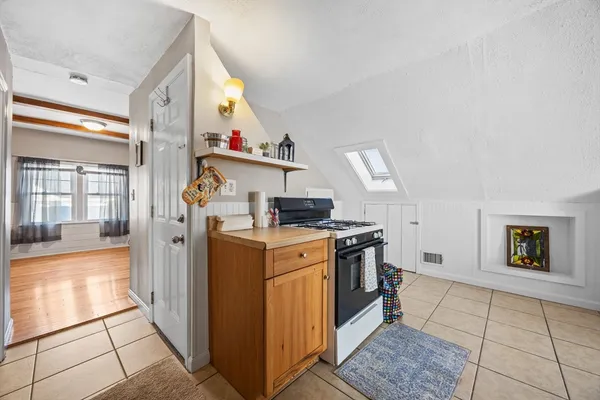 a kitchen with a stove and a refrigerator