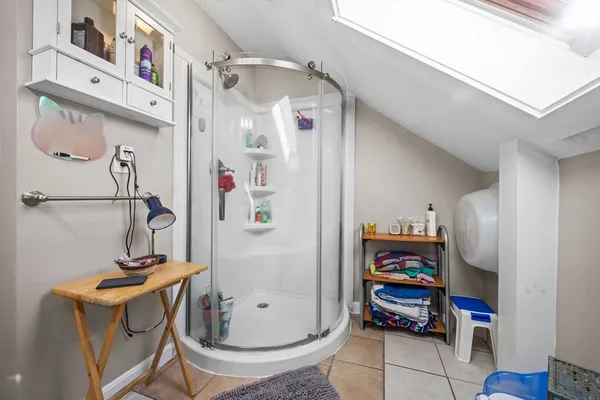 a bathroom with a sink a toilet and a shower