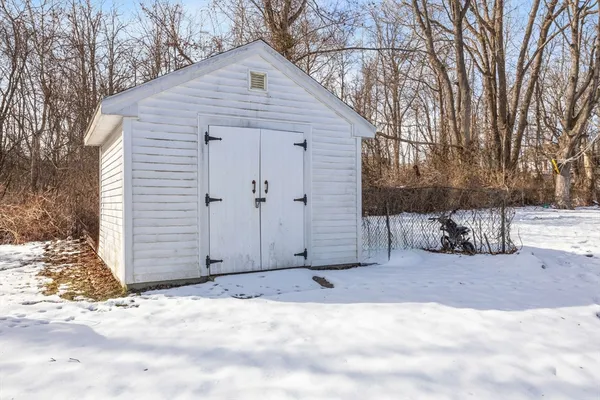 a view of a house with a snow in the yard