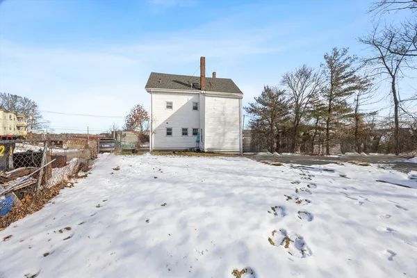 a view of a backyard of the house