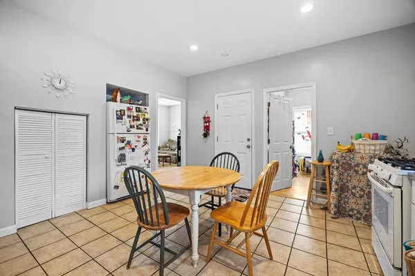 a dining room with furniture and a chandelier