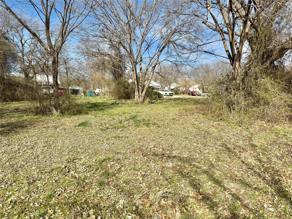 1107 Field Street Gainesville, TX 76240 - Photo 6 of 10 a view of yard with trees