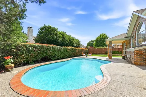 a view of swimming pool with seating space