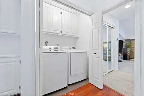 a view of a kitchen with closet and wooden floor
