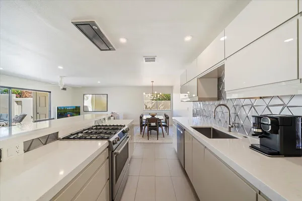 a kitchen with counter top space and appliances