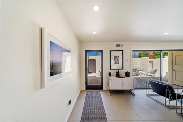 a living room with furniture and natural light