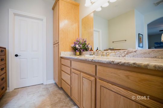 2401 Lacey Street Ridgecrest, CA 93555 - Photo 23 of 44 a bathroom with a sink and a mirror