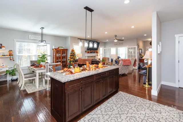 a kitchen with lots of counter top space and dining table