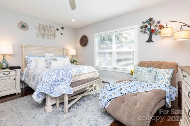 a bedroom with a large bed and a window