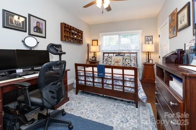 a bedroom with furniture and a window