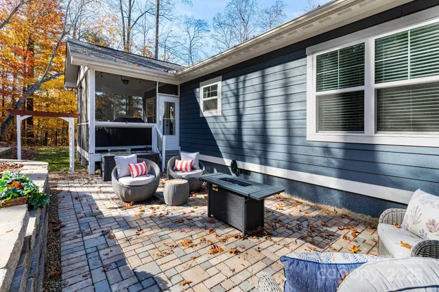 a view of a chairs and table in the balcony