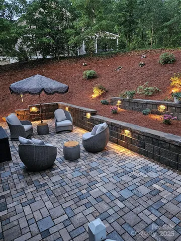 a view of a backyard with sitting area