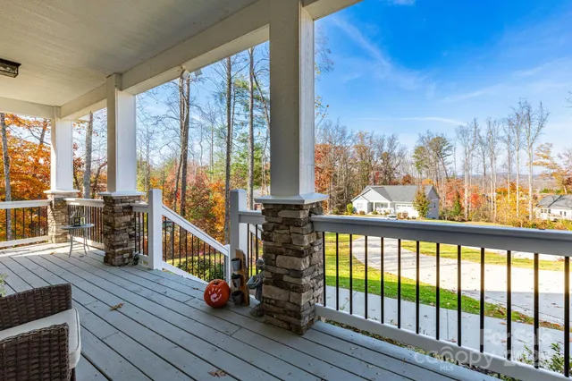 a view of a balcony with chairs