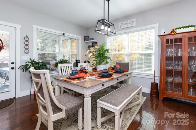 a view of a dining room with furniture window and wooden floor