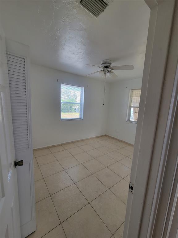 1824 Johnson Street Hollywood, FL 33020 - Photo 9 of 13 an empty room with windows and closet