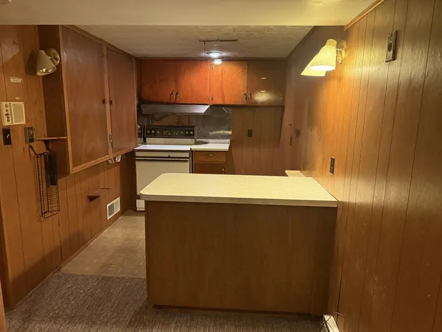 a view of a livingroom with furniture and staircase