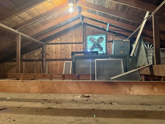 a kitchen with a stove a sink and a window