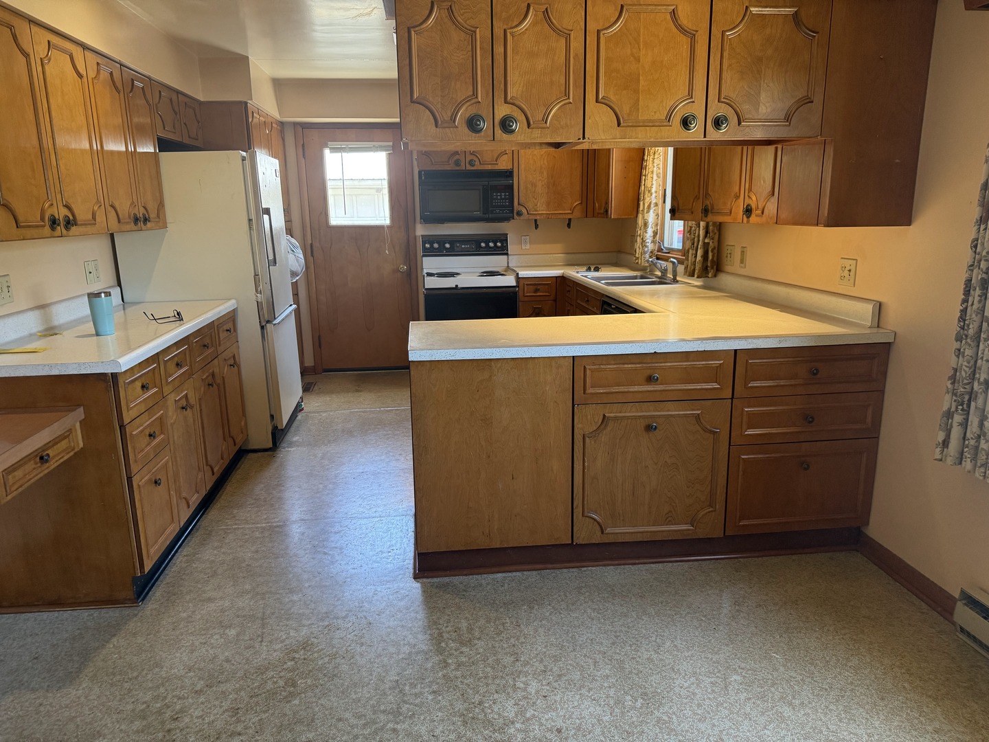 503 East Main Street Morrison, IL 61270 - Photo 4 of 42 a kitchen with sink cabinets and appliances
