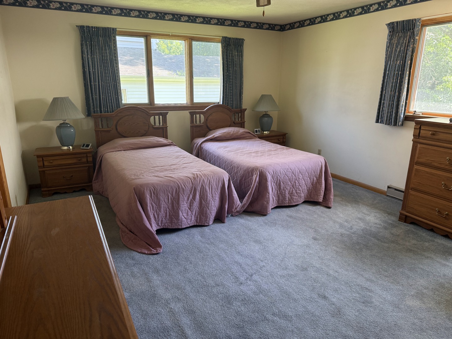 503 East Main Street Morrison, IL 61270 - Photo 10 of 42 a spacious bedroom with two beds and a couch