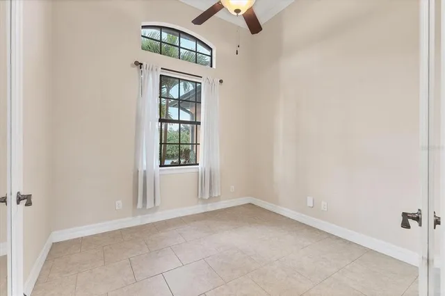 a view of a porch with chairs and backyard