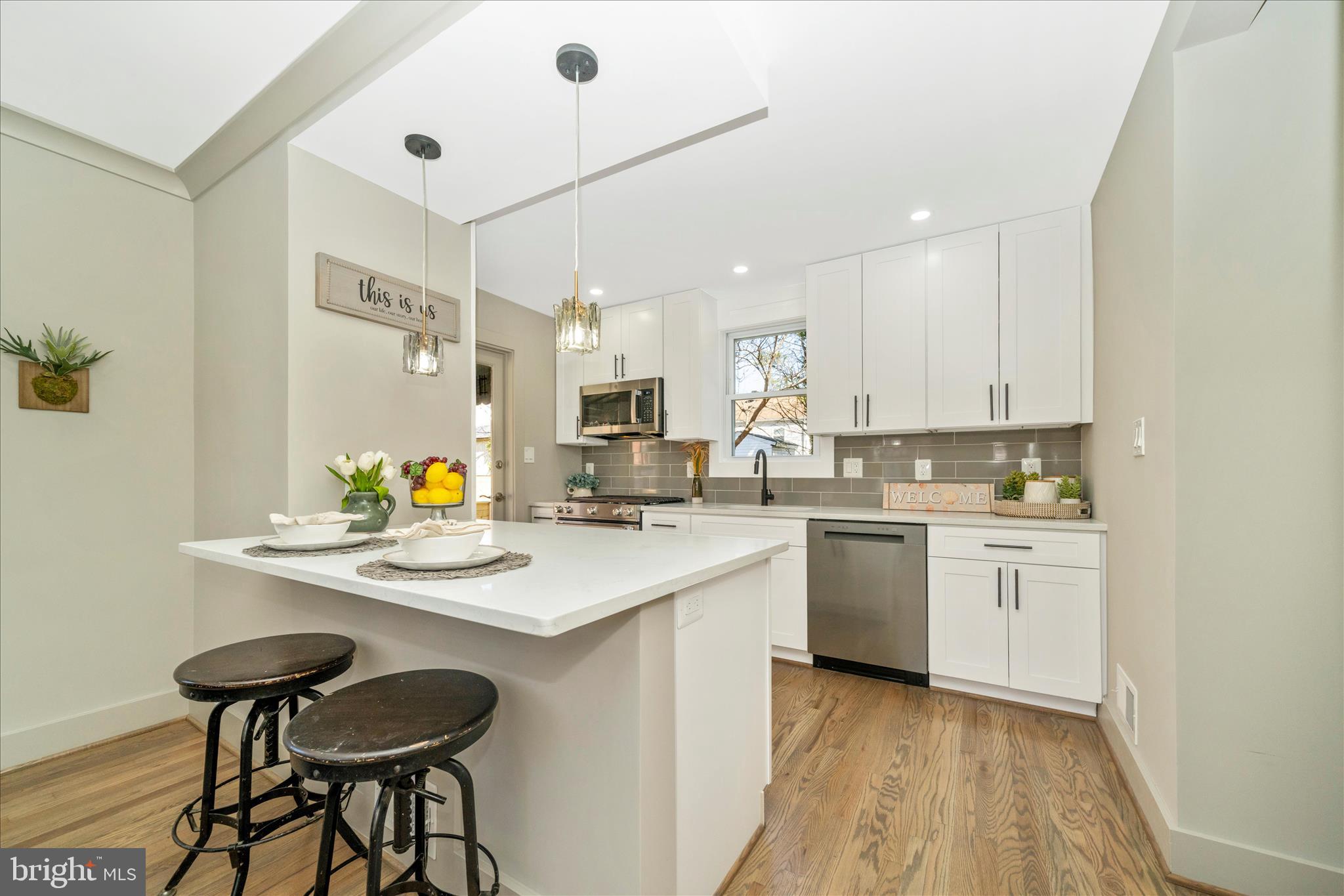 10405 Inwood Avenue Silver Spring, MD 20902 - Photo 11 of 52 a kitchen with a sink cabinets and wooden floor