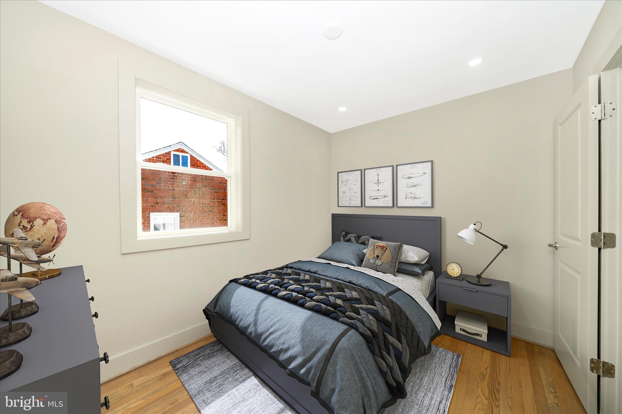 10405 Inwood Avenue Silver Spring, MD 20902 - Photo 24 of 52 a bedroom with a bed and wooden floor