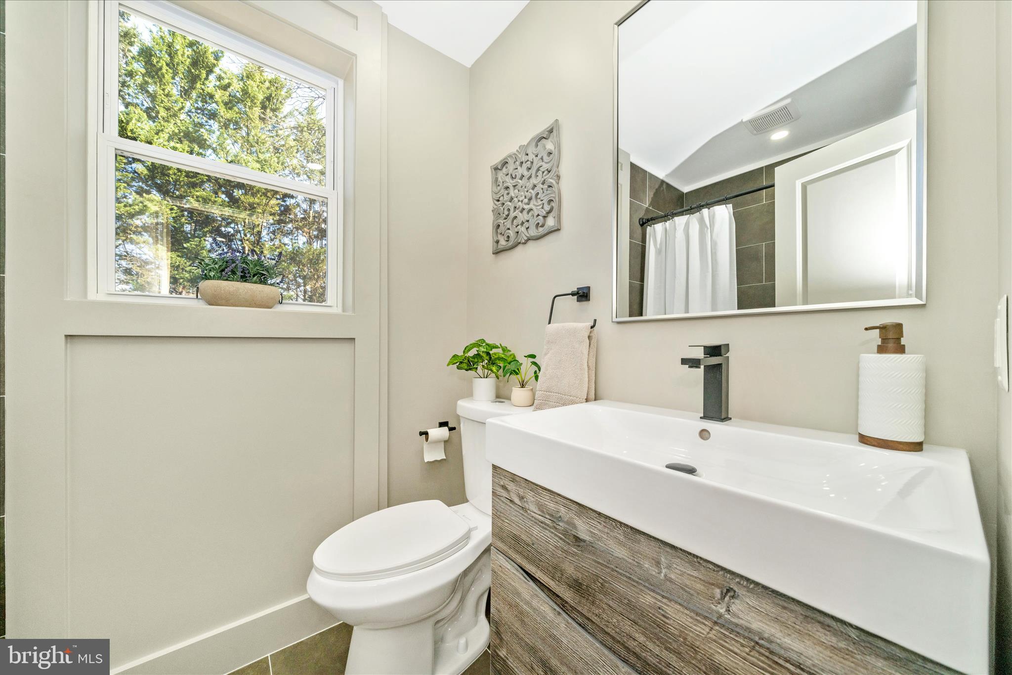 10405 Inwood Avenue Silver Spring, MD 20902 - Photo 26 of 52 a bathroom with a sink and a toilet