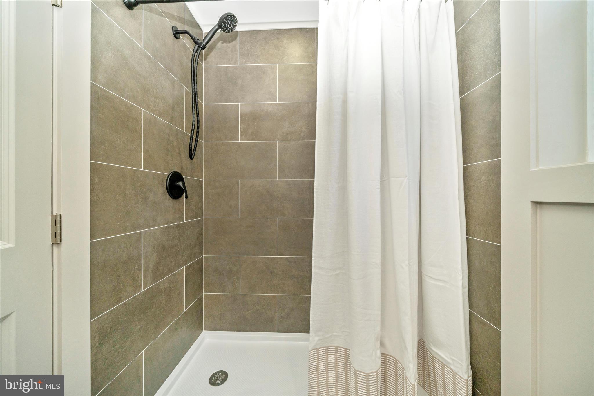 10405 Inwood Avenue Silver Spring, MD 20902 - Photo 27 of 52 a bathroom with a shower