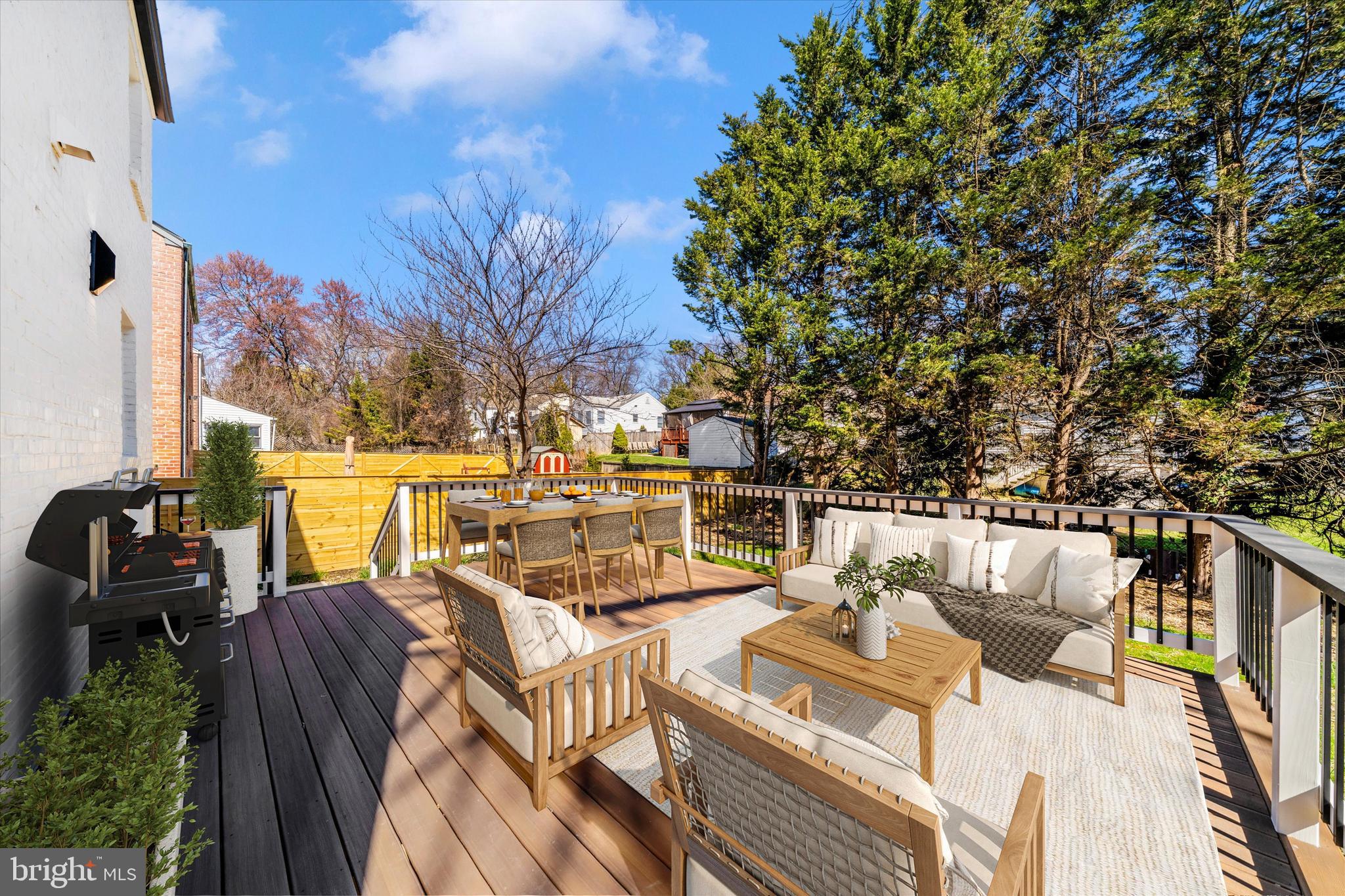10405 Inwood Avenue Silver Spring, MD 20902 - Photo 44 of 52 a view of a patio with couches table and chairs and potted plants
