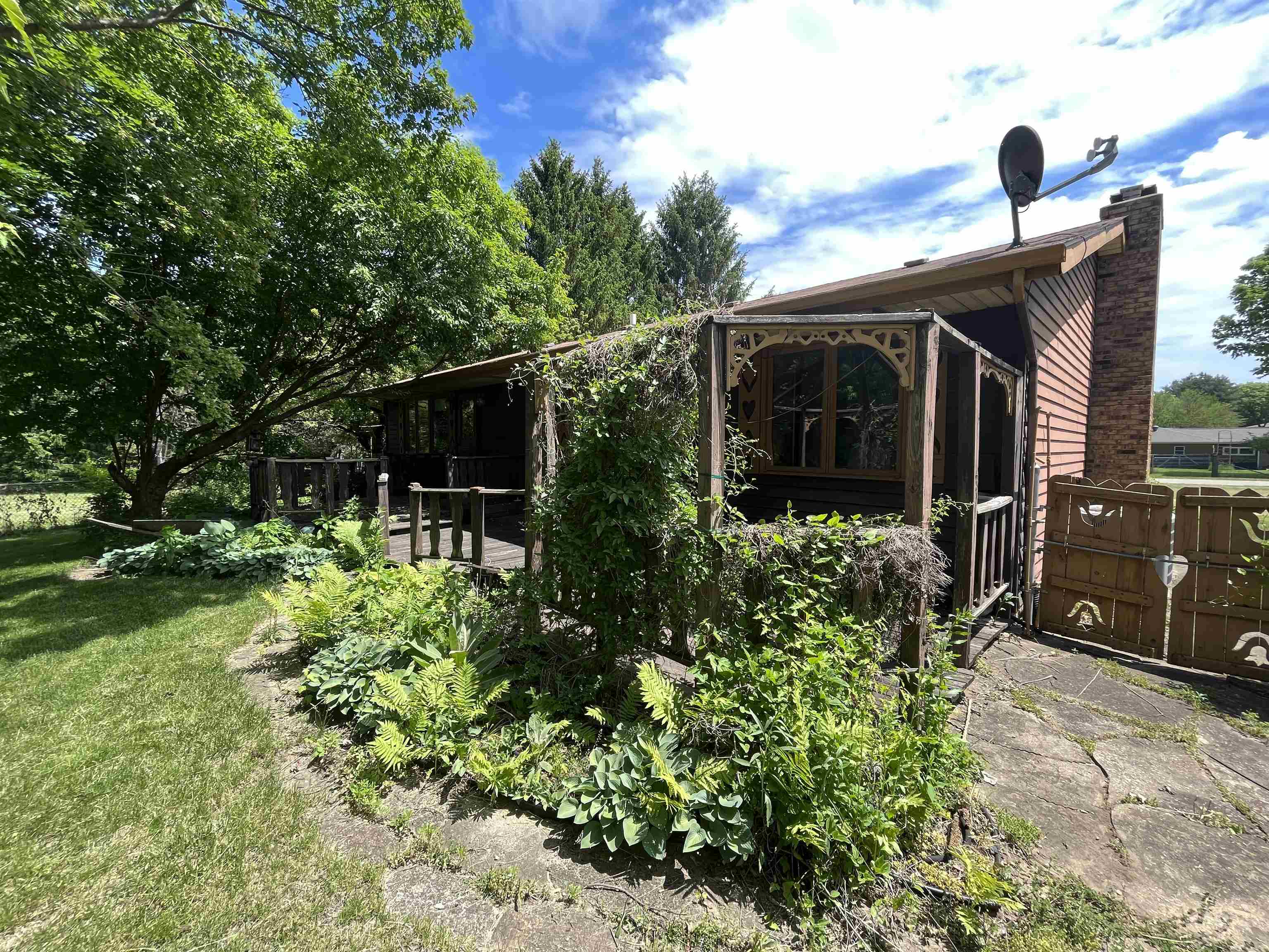 6816 Stardust Trail Roscoe, IL 61073 - Photo 2 of 21 a front view of a house with garden