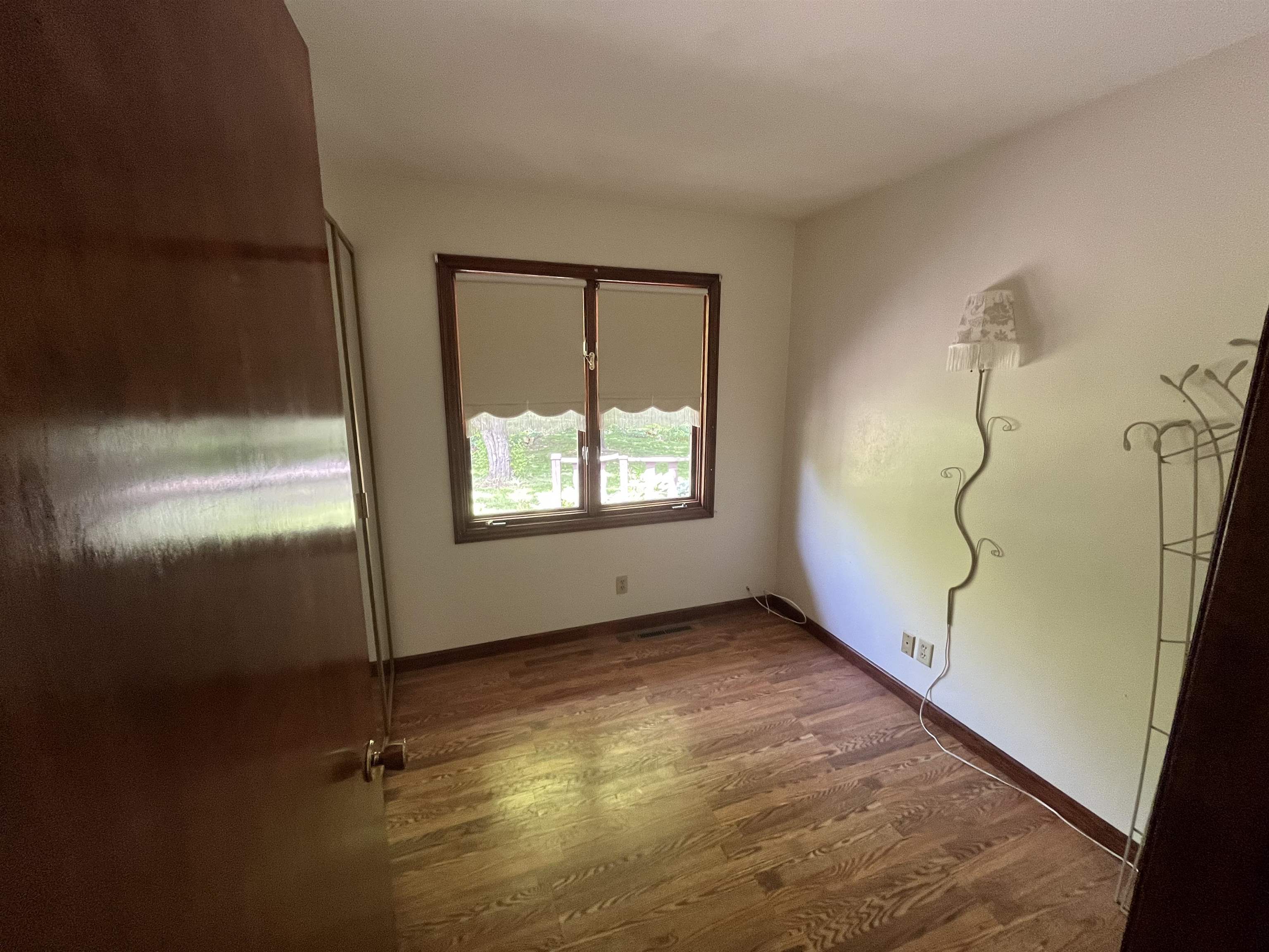 6816 Stardust Trail Roscoe, IL 61073 - Photo 7 of 21 a view of an empty room with a window
