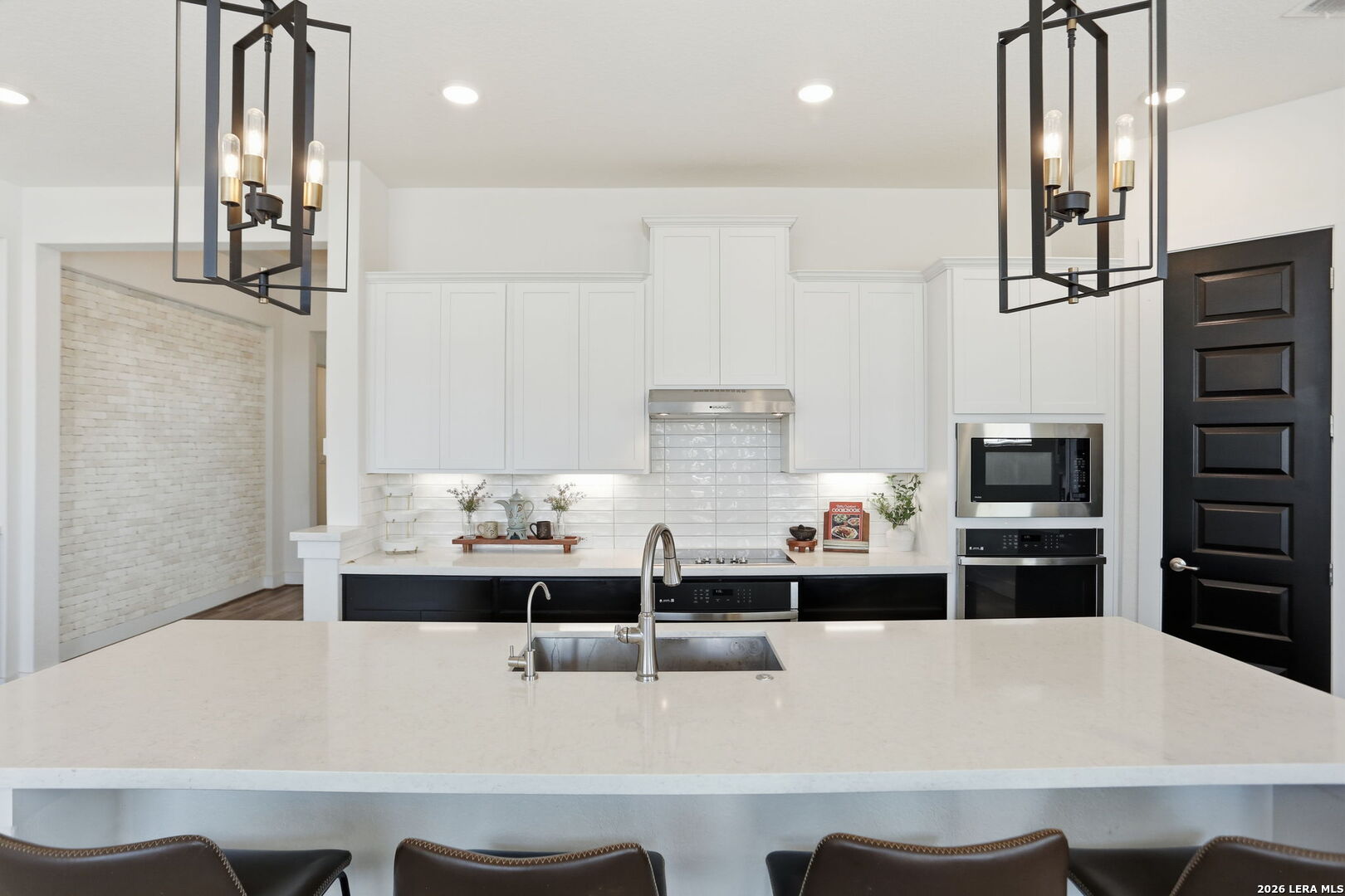 405 Corwin Cibolo, TX 78108 - Photo 18 of 46 a large white kitchen with stainless steel appliances a refrigerator and a stove top oven