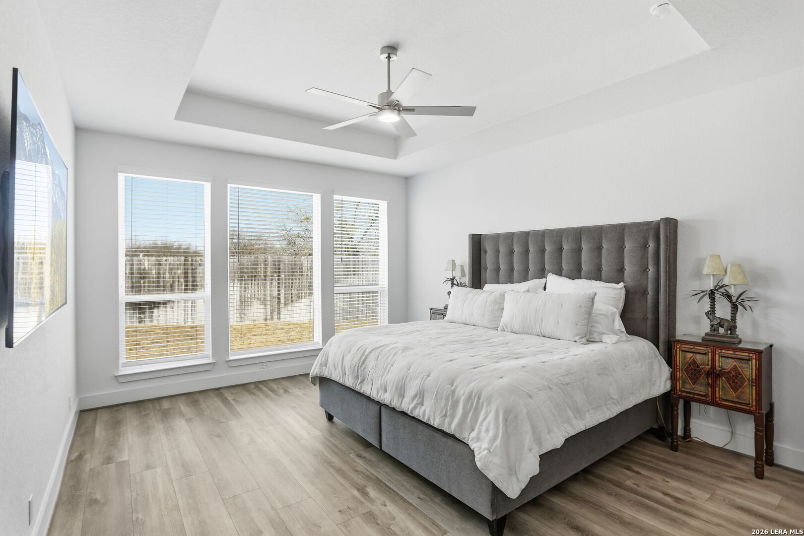 405 Corwin Cibolo, TX 78108 - Photo 21 of 46 a bedroom with a large bed and a large window