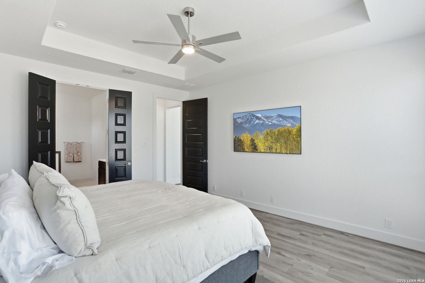 405 Corwin Cibolo, TX 78108 - Photo 22 of 46 a bedroom with a large bed and a chandelier