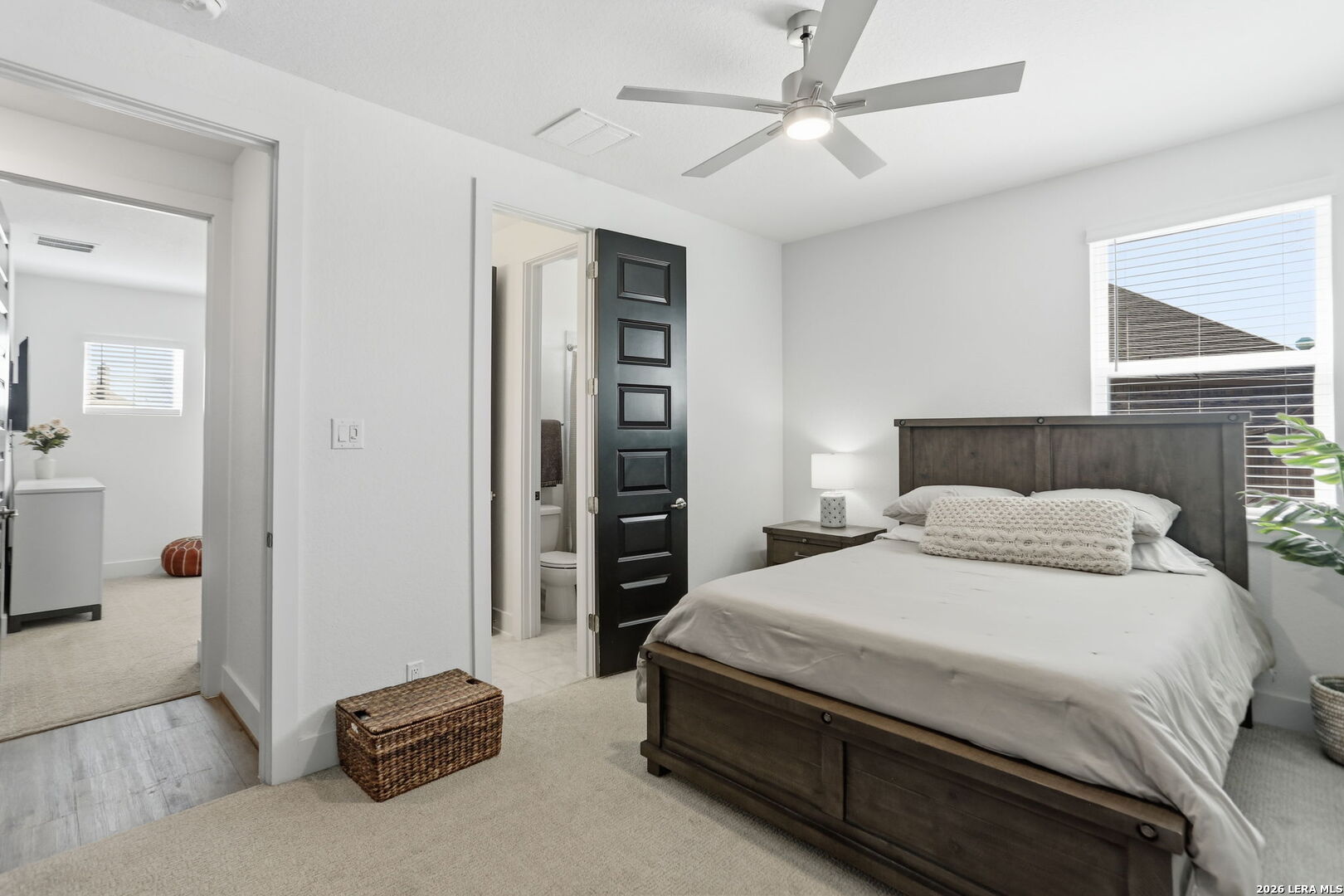 405 Corwin Cibolo, TX 78108 - Photo 26 of 46 a bedroom with a bed and a chandelier