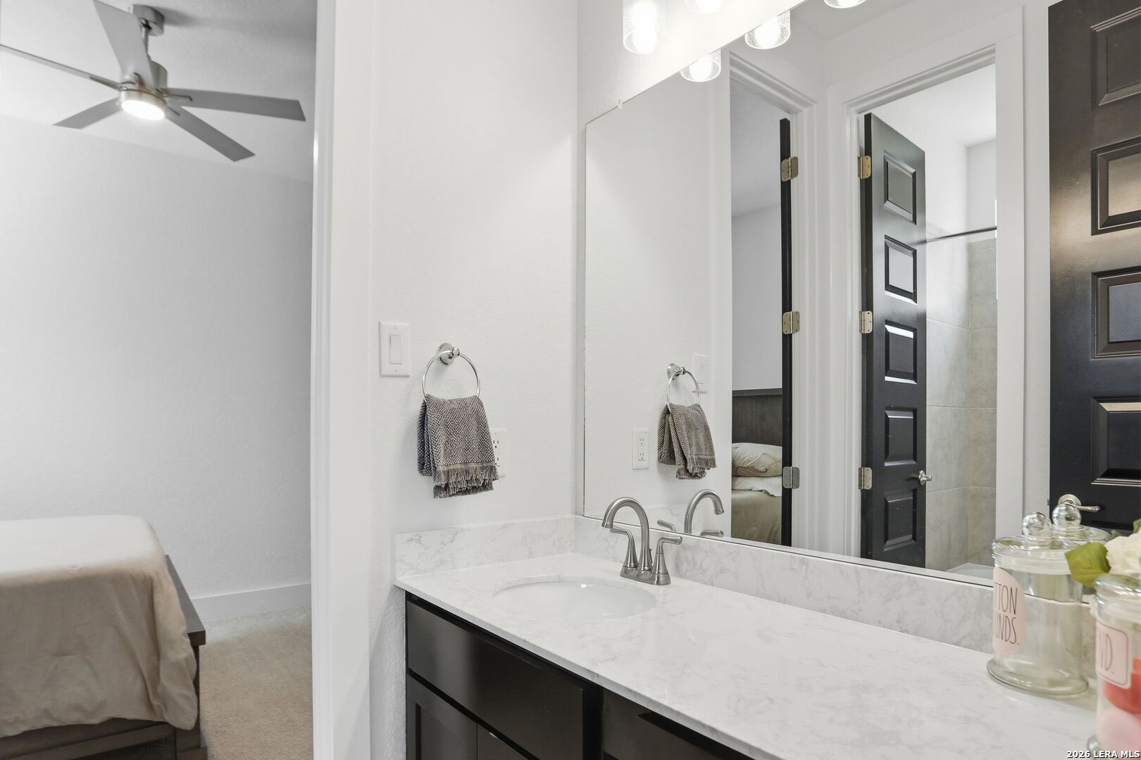 405 Corwin Cibolo, TX 78108 - Photo 27 of 46 a bathroom with a sink vanity and a mirror