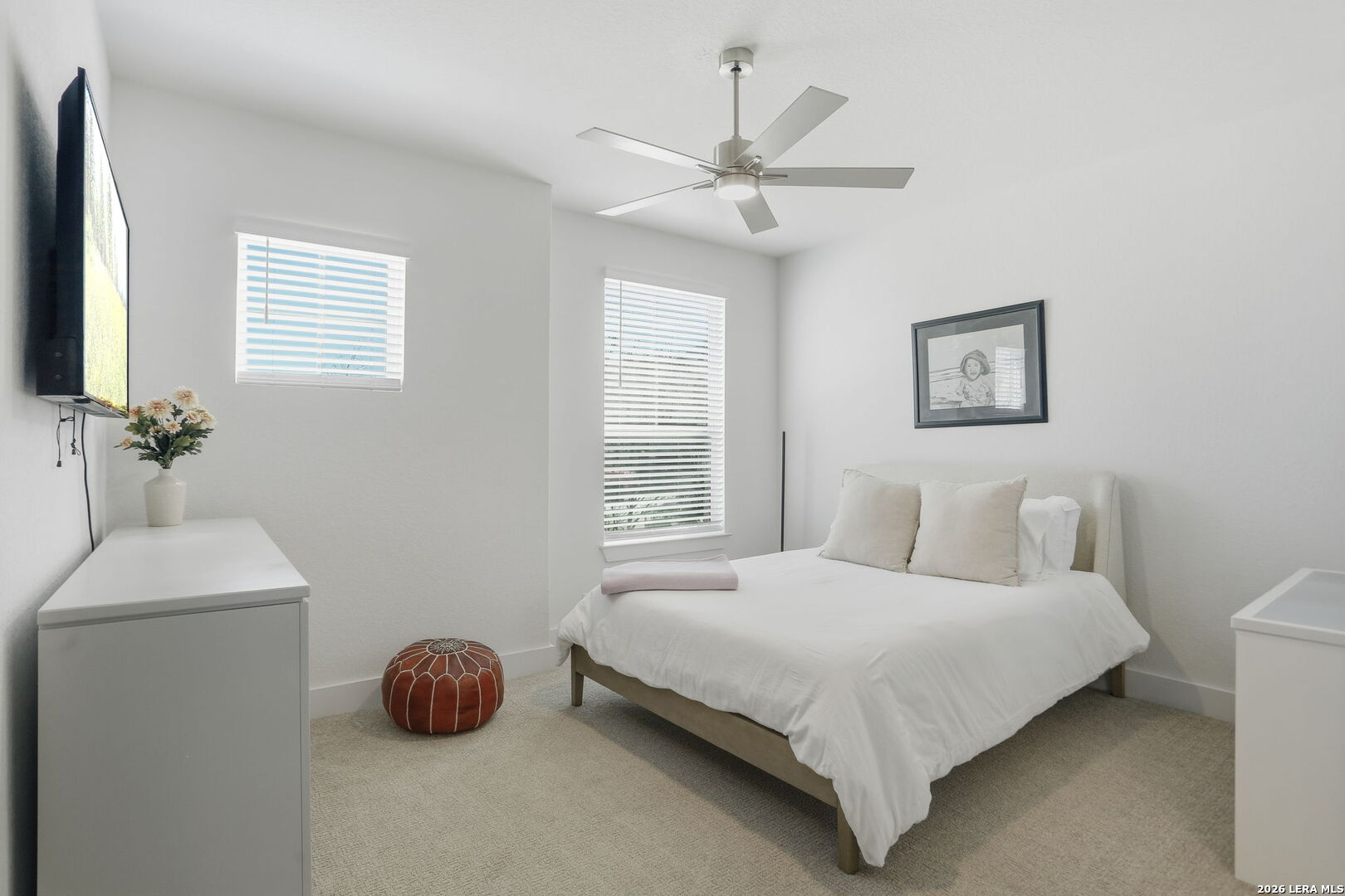 405 Corwin Cibolo, TX 78108 - Photo 28 of 46 a bedroom with a bed and a chandelier