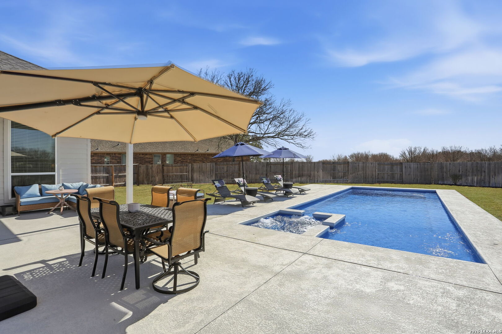 405 Corwin Cibolo, TX 78108 - Photo 34 of 46 a view of backyard with swimming pool and patio