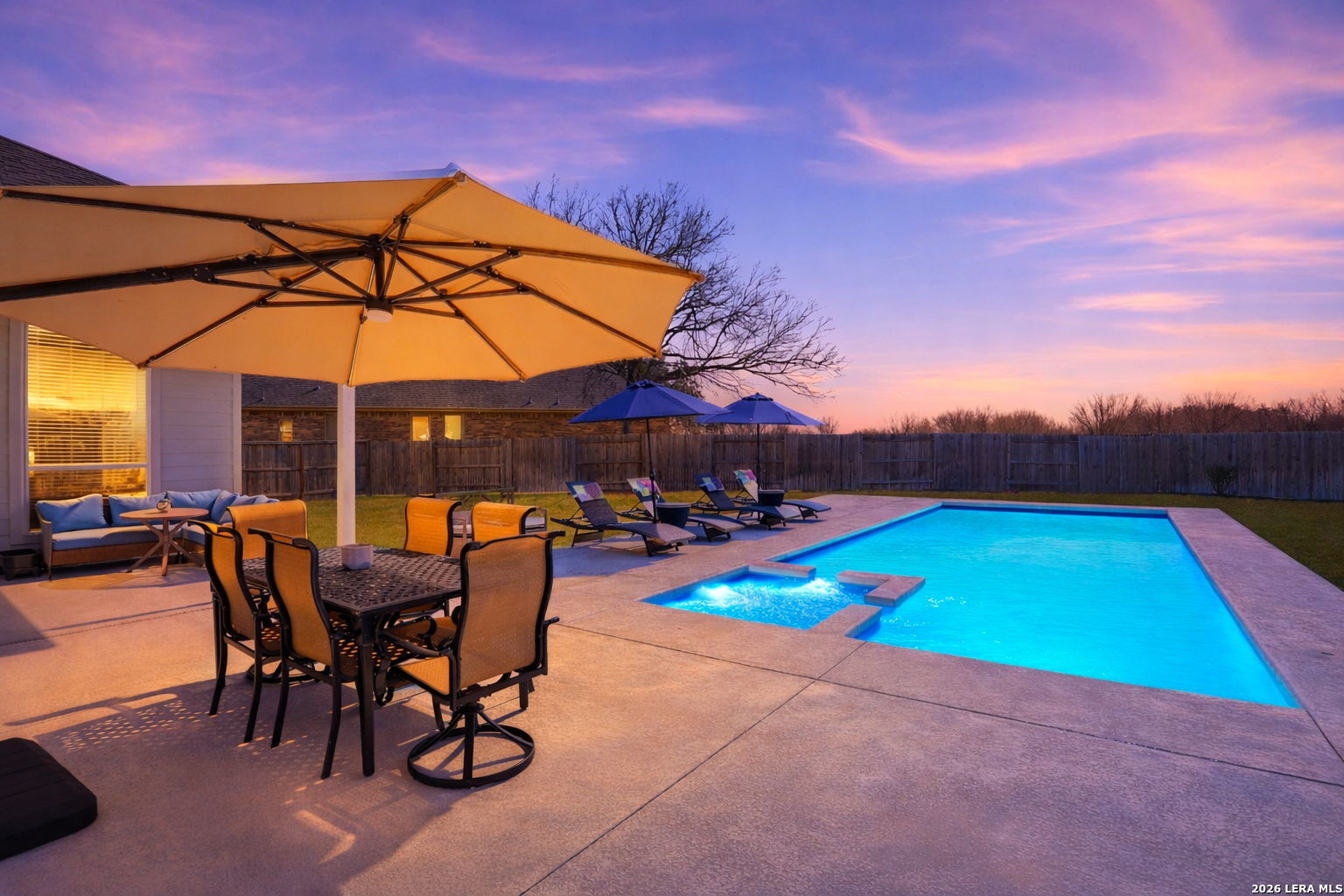 405 Corwin Cibolo, TX 78108 - Photo 40 of 46 an outdoor space with furniture and umbrella