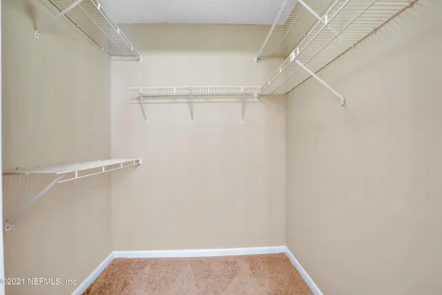 a view of an empty walk in closet