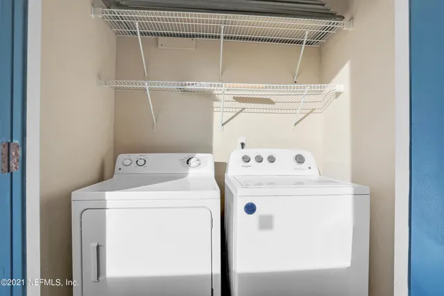 a utility room with dryer and washer