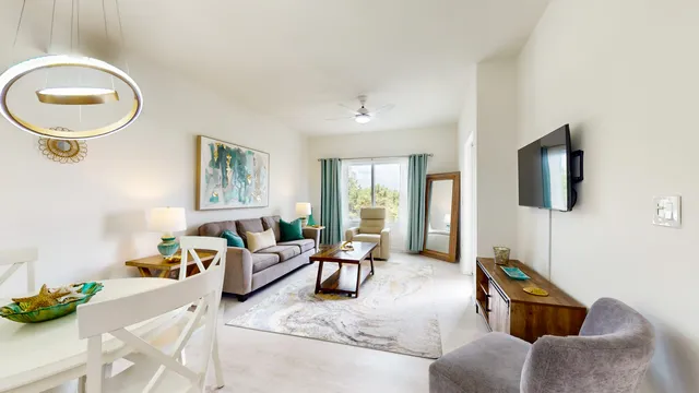 a living room with furniture and a window