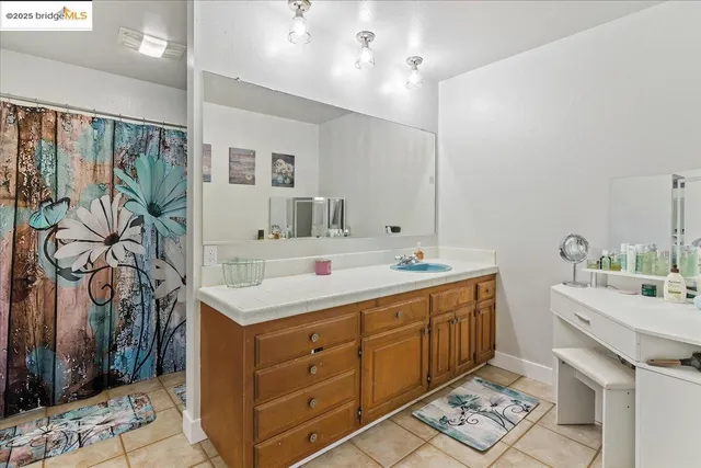 a bathroom with a sink double vanity and a mirror